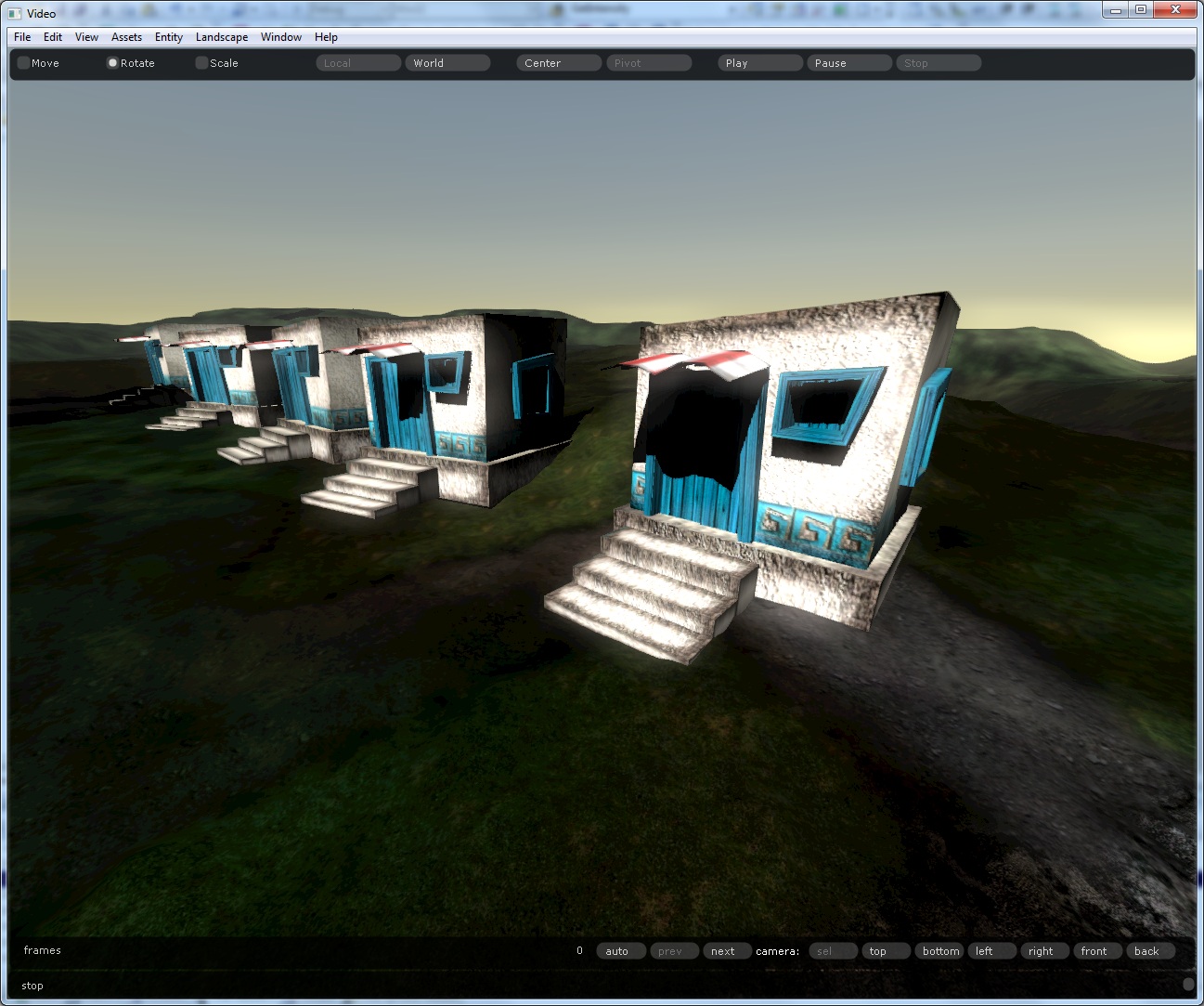 White houses with blue doors on green hills under a low evening sun